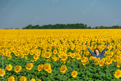 Happy girl on Sunflower field in Russia, Summer, Vacation