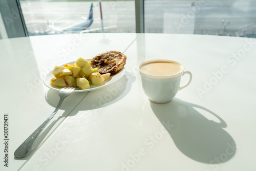 Waiting for the flight in VIP lounge with coffee and meal