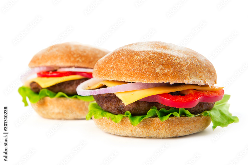 Two tasty fresh burgers isolated on white background Two tasty fresh burgers isolated on white background