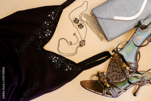Fashion flat lay. Formal evening wear  brown dress  golden chain bag  high heels  accesories