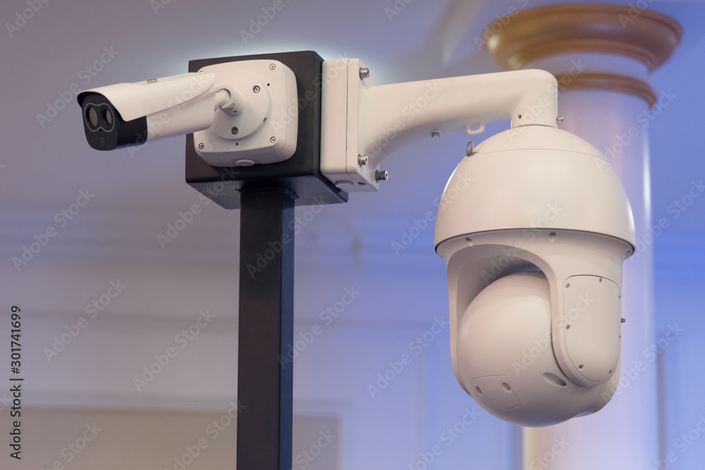 Security CCTV camera or surveillance system in office building, Intelligent cameras can record video all day and night to keep you safe from thieves. Surveillance camera Anti-theft system concept.