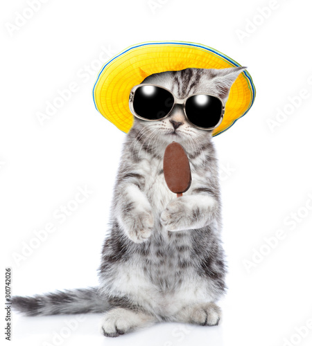 Tabby kitten wearing a summer hat and sunglasses holding ice cream. isolated on white background