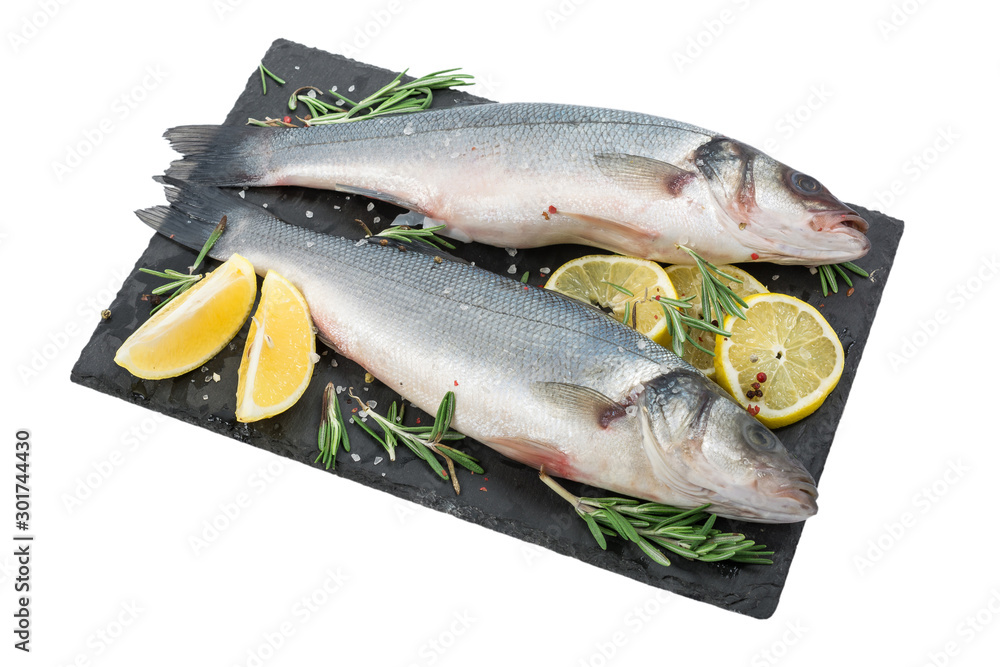 Fresh fish seabass. Raw fish seabass with spices and herbs ingredients for cooking isolated on white background Fresh fish seabass. Raw fish seabass with spices and herbs ingredients for cooking isolated on white background