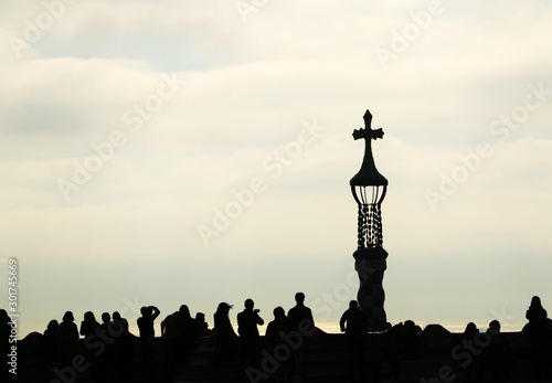 Silhouette view of a Church Spire and people around  People silhouette with a church tower