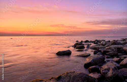 black sea coast at sunset, mountains and stones