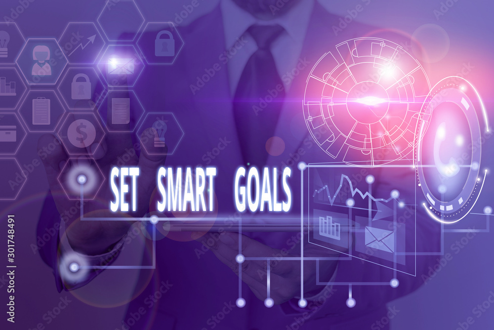 Writing note showing Set Smart Goals. Business concept for giving criteria to guide in the setting of objectives Picture photo network scheme with modern smart device Writing note showing Set Smart Goals. Business concept for giving criteria to guide in the setting of objectives Picture photo network scheme with modern smart device