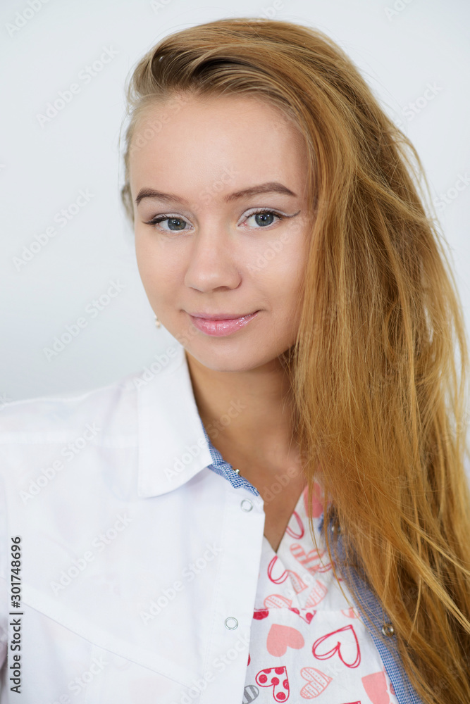 Portrait of young female doctor in white coat Portrait of young female doctor in white coat