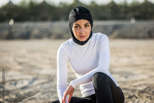 Arabian woman training outdoors © oneinchpunch
