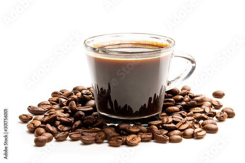 Black coffee in glass cup with beans isolated on white