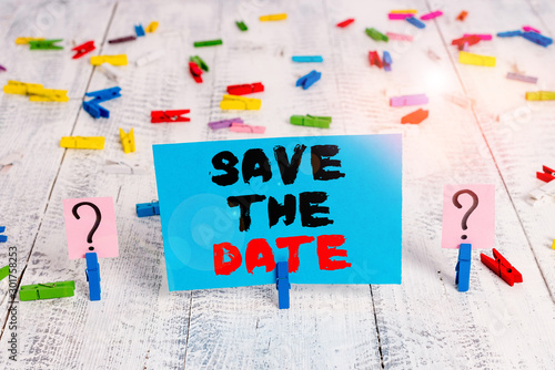 Text sign showing Save The Date question. Business photo showcasing asking someone to remember specific day or time Scribbled and crumbling sheet with paper clips placed on the wooden table