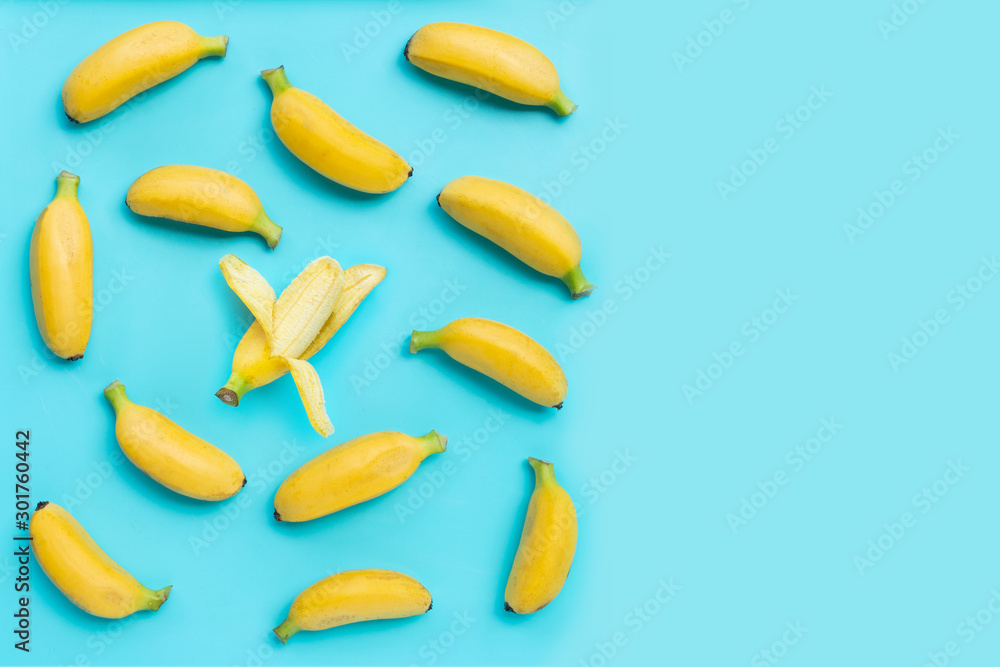 Banana on blue background. Top view Banana on blue background. Top view