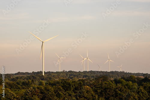 Wind turbines on mountain. ecology concept. © amornchaijj