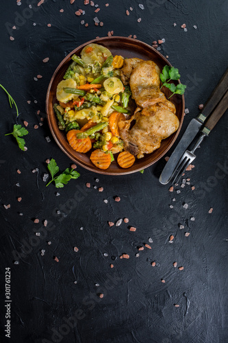 Fried chicken fillet with vegetables.