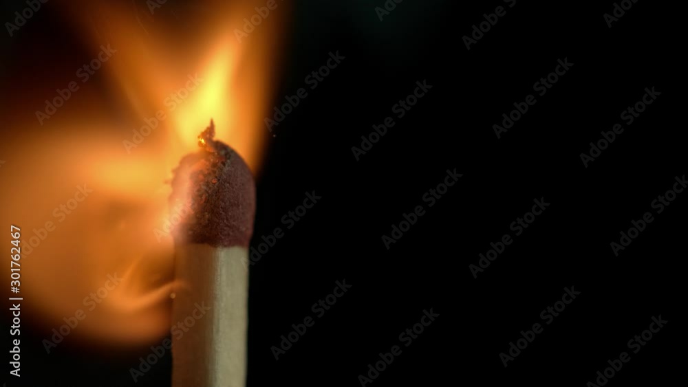 Super Slow Motion Macro Shot of Igniting Match against Black Background at 1000fps. Super Slow Motion Macro Shot of Igniting Match against Black Background at 1000fps.