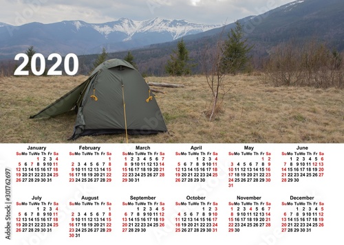 Wall calendar for the whole year. Corporate, home and business calendar. 2020 calendar in table. Calendar on a background mountains, sunset and flowers