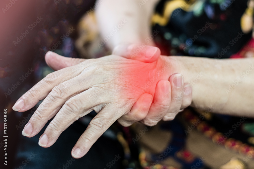 Arthritis chronic ache pain on wrist of old woman concept. Hand of