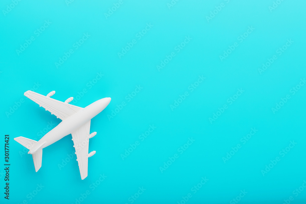 White passenger plane on a blue background. Free space. White passenger plane on a blue background. Free space.