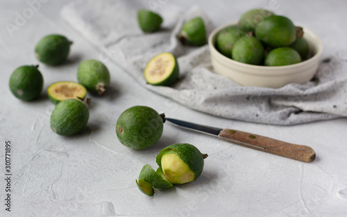 Feijoa fruit on grey background, or pineapple guava healthy tropical fruit photo
