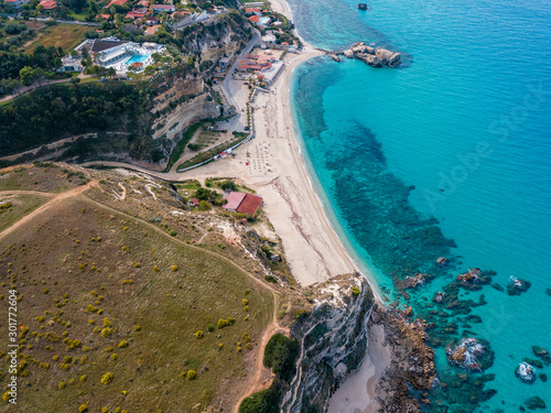 Aerial view of the Calabrian coast, cliffs overlooking the crystal clear sea and luxury villas. Locality of Riaci south of Tropea. Calabria. Italy