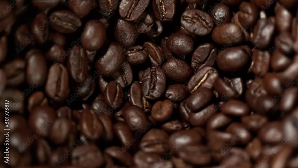 Super Slow Motion Shot of Rotating Coffee Beans in the Grinder at 1000fps. Super Slow Motion Shot of Rotating Coffee Beans in the Grinder at 1000fps.