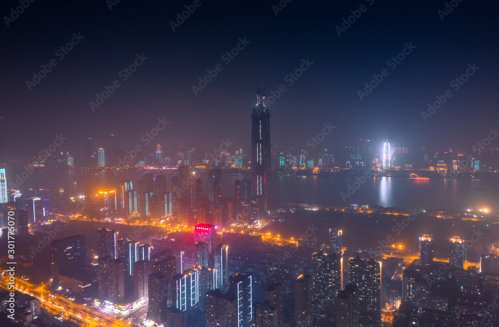 Wide-angle night aerial view of Wuhan financial district, Hubei, China.Financial concept
