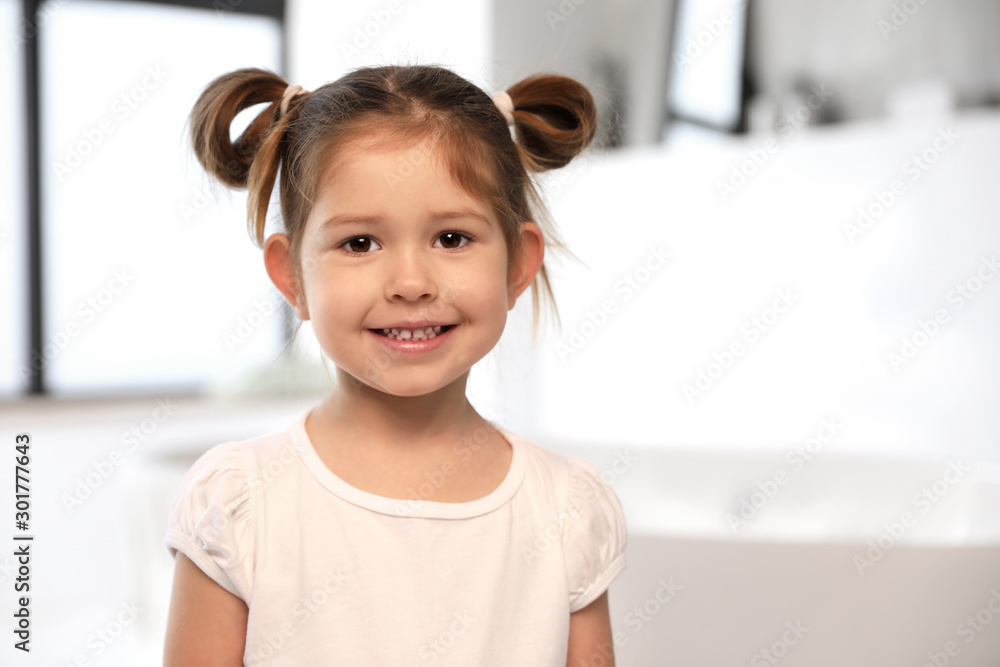 Cute little girl in bathroom. Space for text Cute little girl in bathroom. Space for text