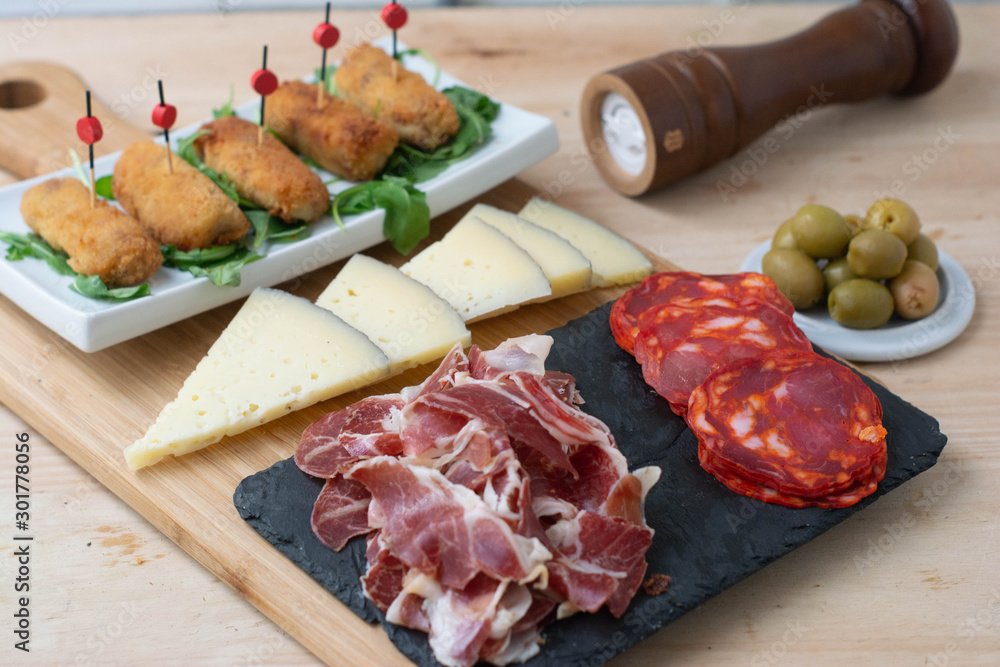  Typical Spanish food consisting of croquettes, Manchego cheese, chorizo ​​and olives