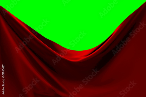 Red fabric pulled to the side with green screen background. 