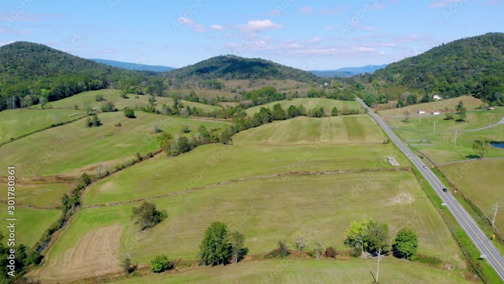 Forward moving aerial view over a countryside highway leading to Shenandoah National Park, Virginia, U.S.A, surrounded by beautiful green landscape.(1) Forward moving aerial view over a countryside highway leading to Shenandoah National Park, Virginia, U.S.A, surrounded by beautiful green landscape.(1)