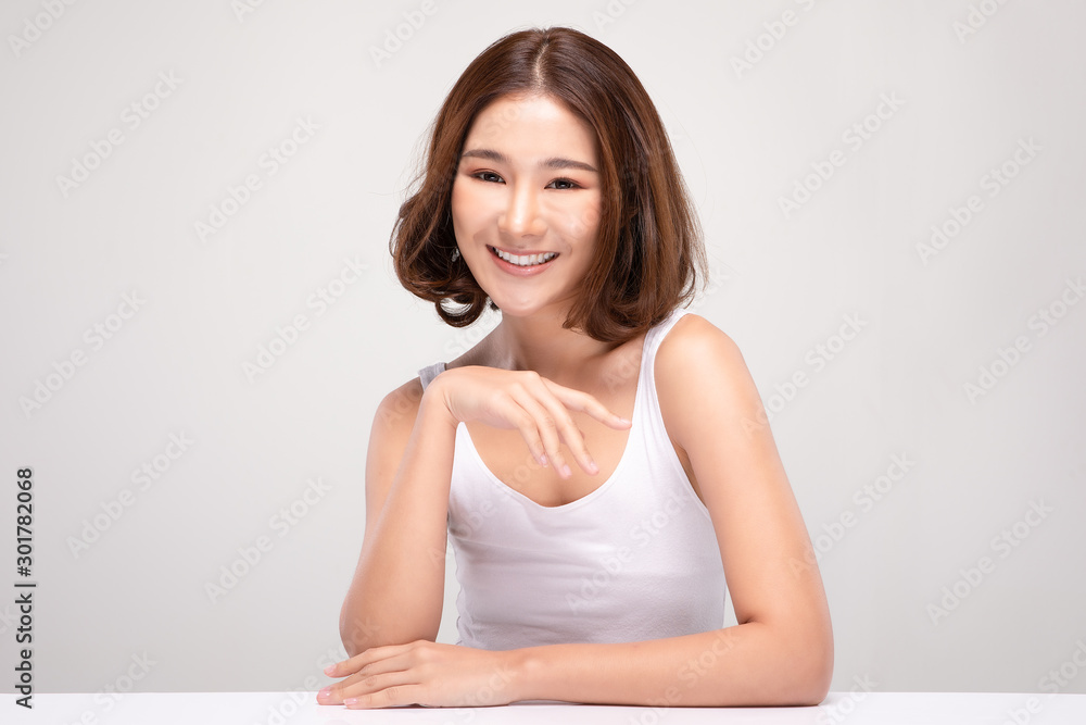 Beautiful Asian woman with short hair looking at camera smile with clean and fresh skin Happiness and cheerful with positive emotional,isolated on gray background,Beauty and Cosmetics Concept Beautiful Asian woman with short hair looking at camera smile with clean and fresh skin Happiness and cheerful with positive emotional,isolated on gray background,Beauty and Cosmetics Concept