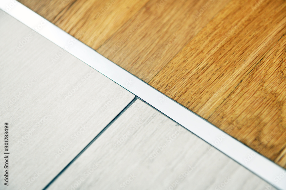 aluminum threshold between ceramic tiles and parquet	