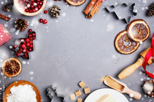 Festive Christmas flat lay with items and ingredients for baking cookies or gingerbread.