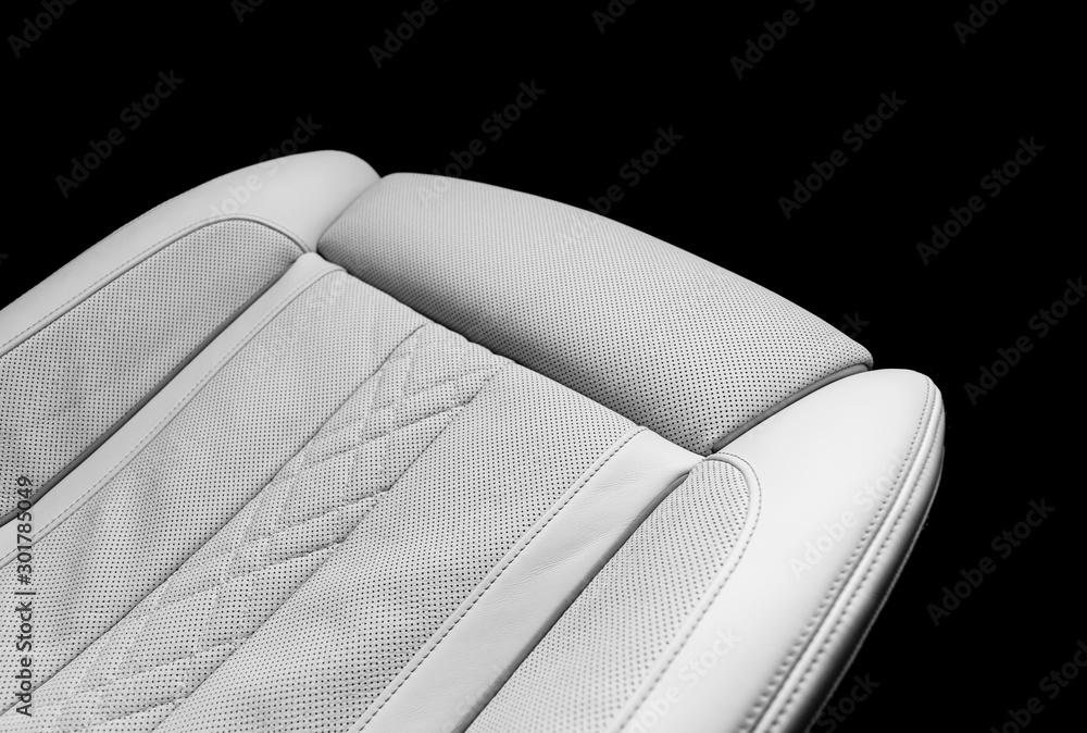 White leather interior of the luxury modern car. Perforated white