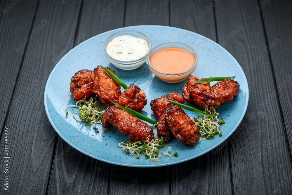 Baked chicken wings in the Asian style on plate