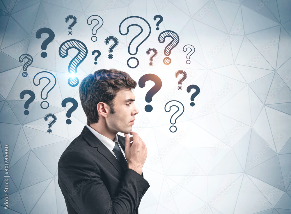 Thoughtful businessman and question marks Thoughtful businessman and question marks