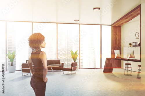 African businesswoman in white office lounge