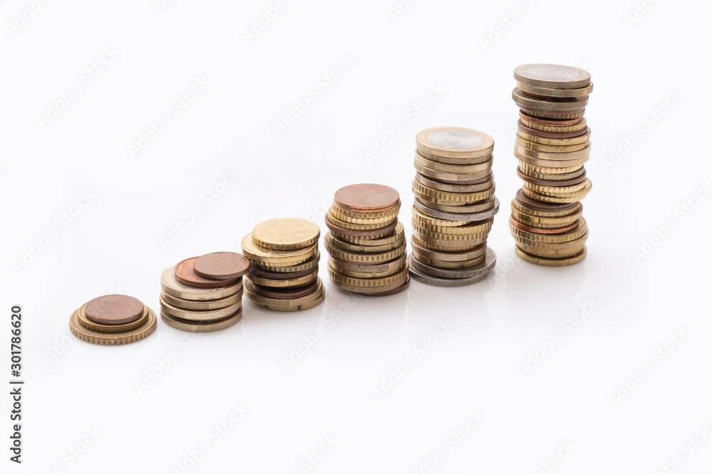 Rising stacks of euro coins isolated on white, interest and growth concept Rising stacks of euro coins isolated on white, interest and growth concept