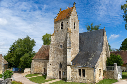 Bilde på lerret Sceaux-sur-Huisne, France - Typical french village near Le Mans - The church