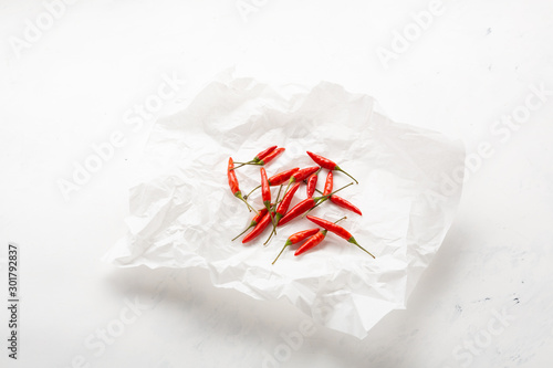 Red thai hot pepper on paper