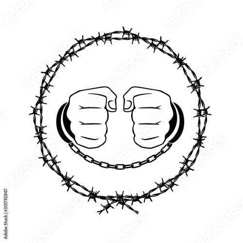 handcuffed hands in a barbed wire wreath