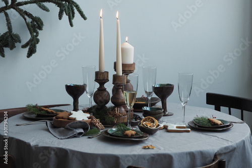 Round served table with festive vintage table setting...