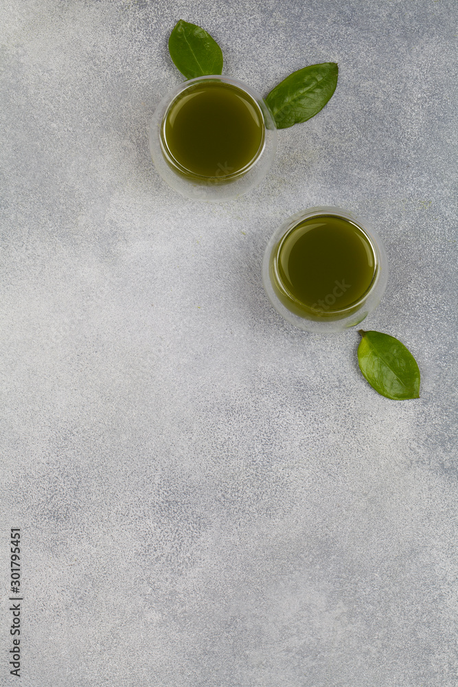 Japanese matcha green tea in cup on blue background. Top view Japanese matcha green tea in cup on blue background. Top view