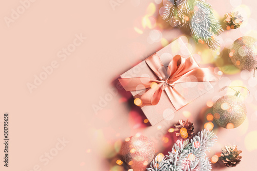 Christmas gift box flat lay on pink background © Denira
