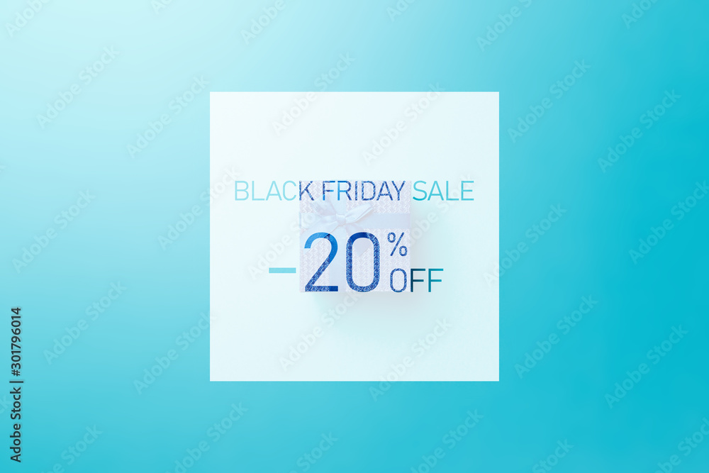 Black friday sale. Up to 20% discount. Text over Blue gift box with blue ribbon on blue background. Word BLACK FRIDAY on blue background. Flat lay. Minimal creative concept. Trendy pastel color Black friday sale. Up to 20% discount. Text over Blue gift box with blue ribbon on blue background. Word BLACK FRIDAY on blue background. Flat lay. Minimal creative concept. Trendy pastel color