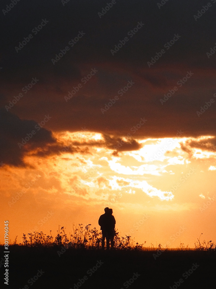 silhouette of man in sunset