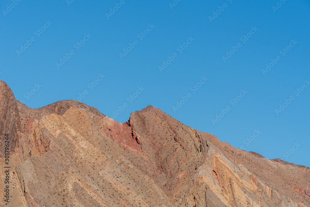 Low angle landscape of barren yellow hillside in Lake Mead National Recreation Area in Nevada
