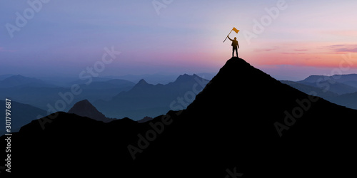 Silhouette of Businessman standing on mountain top over sunset twilight background with flag, Winner, Success and Leadership concept
