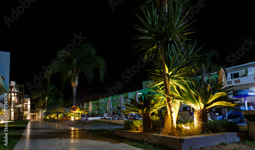 infrastructure of the resort European hotel night, stairs, tables, bar, palm trees, the concept of summer holidays . Greece