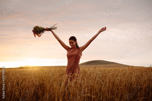 Woman enjoying a day in wheat field