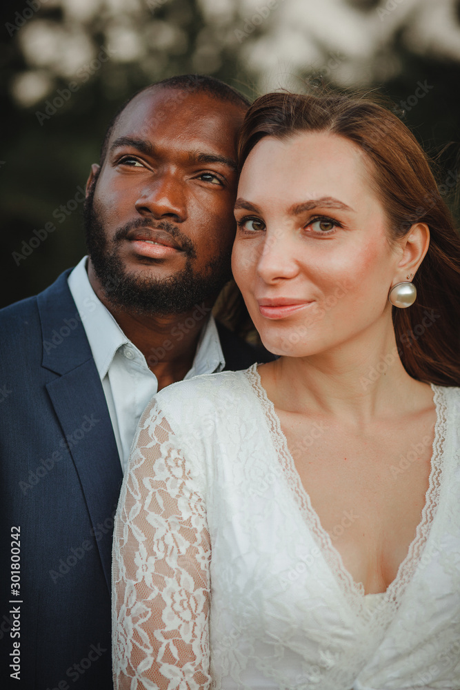 happy and beautiful mixed ethnicity couple with beautiful afro American man and cheerful europian woman loking in different directions happy and beautiful mixed ethnicity couple with beautiful afro American man and cheerful europian woman loking in different directions
